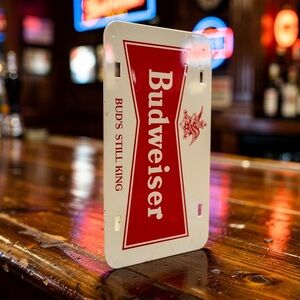 Rare Budweiser License Plate On One Side and Indy 500 Spectators Race On The Oth